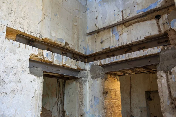 Restoration work on an old historical building. Strengthen doorway during the restoration of the ancient castle. Metal channels, beams strengthening doorways of the building during reconstruction