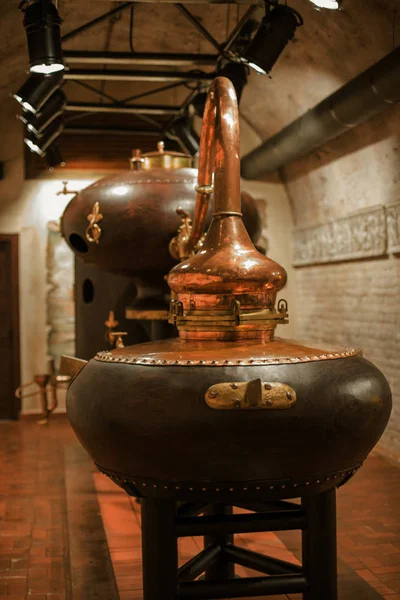 medieval traditional distiller, cube made from copper production of alcohol, cognac, whiskey. Fragment of copper old distiller for alcohol production. Ancient traditional food technologies for alcohol