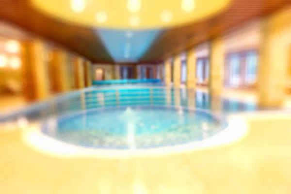 Swimming pool in a recreation area camping blurred background. Fuzzy interior basin with warm dark colors. As a basis for creative fashion design.