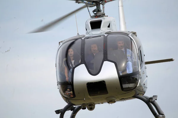 ODESSA, UKRAINE - June 4, 2013: Presentation of the private test light modern civil helicopter business class on a small private airport in the summer on a cloudy day