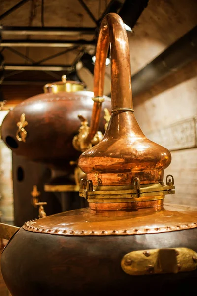 medieval traditional distiller, cube made from copper production of alcohol, cognac, whiskey. Fragment of copper old distiller for alcohol production. Ancient traditional food technologies for alcohol