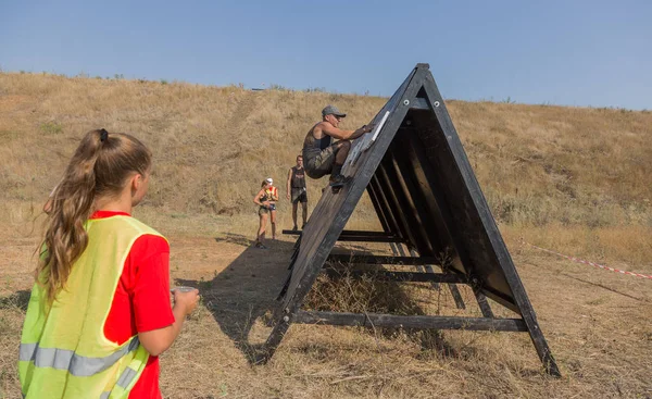 stock image ODESSA, UKRAINE - August 19, 2018: traditional sports races of the nation. Ukrainian race with obstacles for survival, swimming marathon in open sea water, extreme tests on a dangerous route