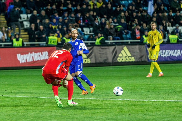 ODESSA, UKRAINE -24 March 2016: A friendly game between the national football team of Ukraine (yellow) and the national team of Cyprus (blue). Game moment of intense soccer match.