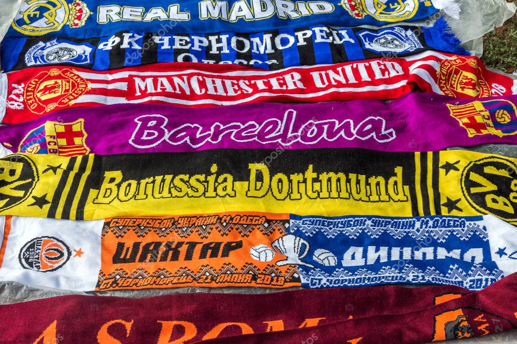 ODESSA, UKRAINE - July 21, 2018. Before game, football symbols, football souvenirs are sold. Unofficial merchandising of professional football clubs. Sale of football symbols, attributes, scarves