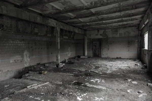 Interior of the destroyed buildings of old factory. ruins of an industrial enterprise, dark fragments destroyed factory premises at plant as result of economic crisis Catacombs, basement, tunnel