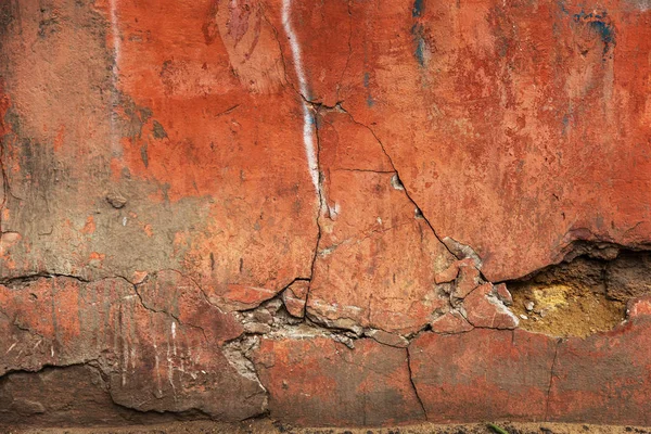 old art texture of plaster brick wall. Painted bad scratched surface in fissures of painted stucco of stone brick wall with petal texture. rubbed facade of building with damaged plaster background