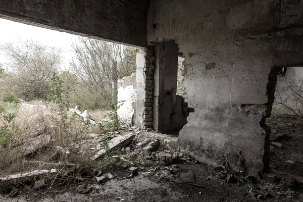 Interior of the destroyed buildings of old factory. ruins of an industrial enterprise, dark fragments destroyed factory premises at plant as result of economic crisis Catacombs, basement, tunnel