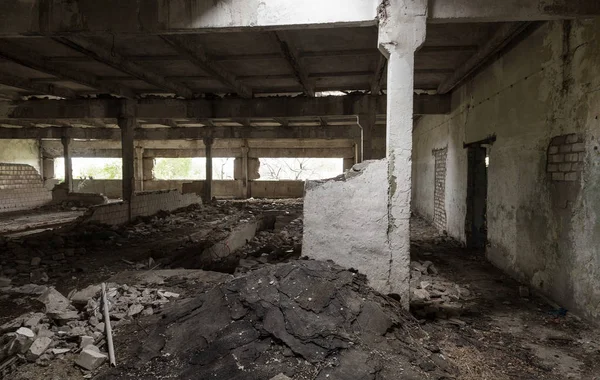 Interior of the destroyed buildings of old factory. ruins of an industrial enterprise, dark fragments destroyed factory premises at plant as result of economic crisis Catacombs, basement, tunnel