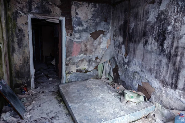 Abandoned house, spooky interior of ruined house with furnished rooms, bardel; Hotel;  meeting house. Old collapsing house; Abandoned house interior. Ruined house in poor residential quarter in slum