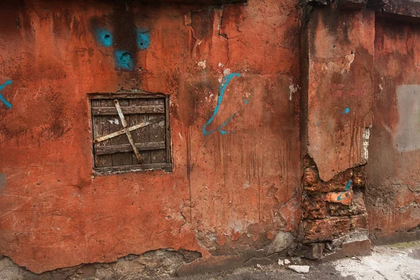 old art texture of plaster brick wall. Painted bad scratched surface in fissures of painted stucco of stone brick wall with petal texture. rubbed facade of building with damaged plaster background