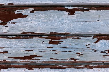 Ahşap kavramsal arka plan. Ahşap kurulların eski boyalı arka plan. Ahşap kalkan soyulması boya izleri eski bir kırık. Antik bir eski boyalı ahşap gürültü kalkan yüzeyi kavramı