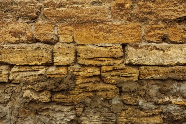 Arka plan tasarımı için. Taş duvar. Doğal taş eski taş tasarım projesi için arka plan arka plan olarak arka plan. Doğal kabuklu deniz ürünleri, bir yeraltı ocağı taştan taş duvardan sanatsal arka plan