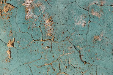 Çatlaklar. Arka plan yüzeyi ile yaratıcı çatlaklar. Yaratıcı tasarım düzen için arka plan olarak Web çatlaklar. Çimento tabakasının taş yüzeyi derin çatlaklar oluşan bir ağ ile. Endişeli appearanc