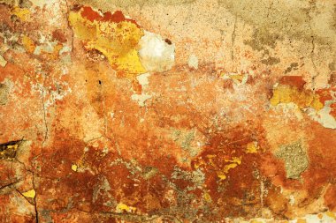 Alçı tuğla duvarın boş eski sanat dokusu. Yaprak dokusuyla boyanmış taş tuğla duvarın çatlaklarıyla kötü çizilmiş yüzey. Hasarlı alçıyla binanın ön cephesini ovaladım.