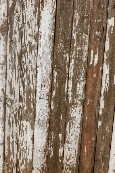 Ancient vintage style painted white wooden texture with remains of white paint. Very old, grunge, rustic wood texture with natural patterns and cracks on surface as wooden background