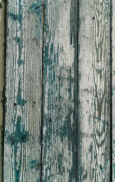 Ancient vintage style painted white wooden texture with remains of white paint. Very old, grunge, rustic wood texture with natural patterns and cracks on surface as wooden background