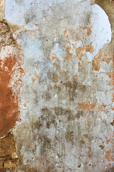 Empty old art texture of plaster brick wall. Painted bad scratched surface in fissures of painted stucco of stone brick wall with petal texture. rubbed facade of building with damaged plaster
