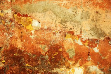 Alçı tuğla duvarın boş eski sanat dokusu. Yaprak dokusuyla boyanmış taş tuğla duvarın çatlaklarıyla kötü çizilmiş yüzey. Hasarlı alçıyla binanın ön cephesini ovaladım.