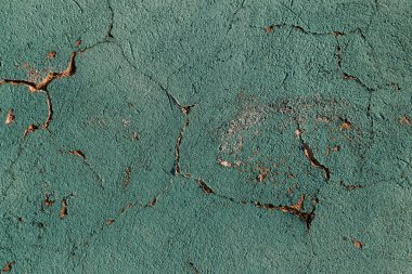Çatlaklar. Arka plan yüzeyi ile yaratıcı çatlaklar. Yaratıcı tasarım düzen için arka plan olarak Web çatlaklar. Çimento tabakasının taş yüzeyi derin çatlaklar oluşan bir ağ ile. Endişeli appearanc