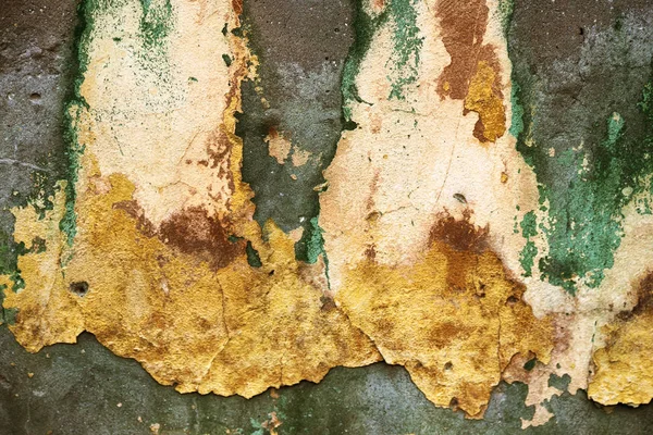 Empty old art texture of plaster brick wall. Painted bad scratched surface in fissures of painted stucco of stone brick wall with petal texture. rubbed facade of building with damaged plaster