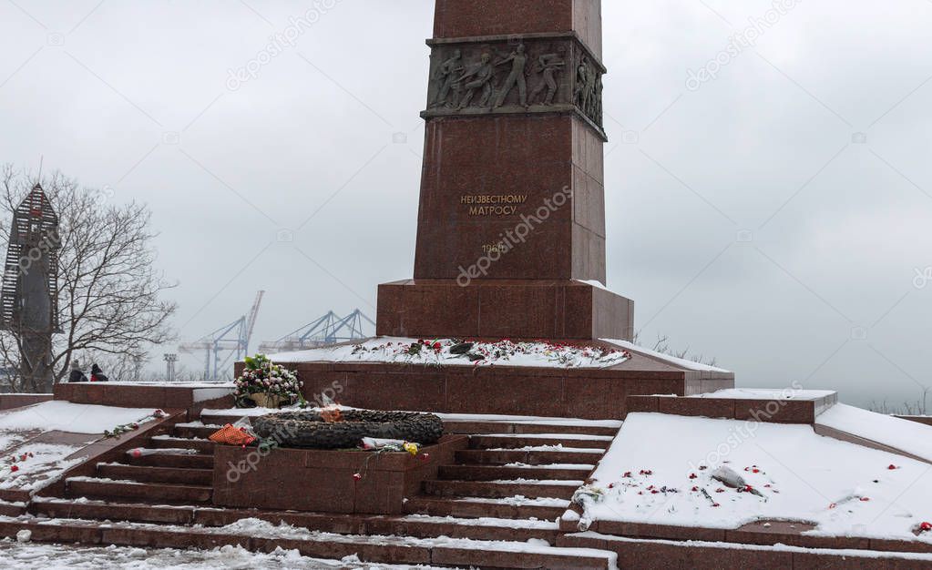 monument to Eternal Flame to an unknown soldier in Odessa. Eternal Fire, unknown soldier, memorial of memory in winter, flowers under snow on granite monument of Memory of the Great Patriotic War