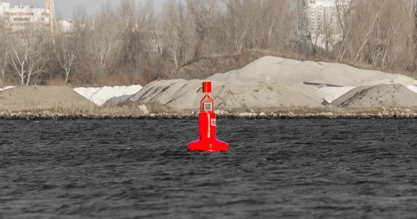 Navigation buoy from the river channel at the mouth of the river. Navigation buoy on the fairway of the river indicates the path for the passage of ships