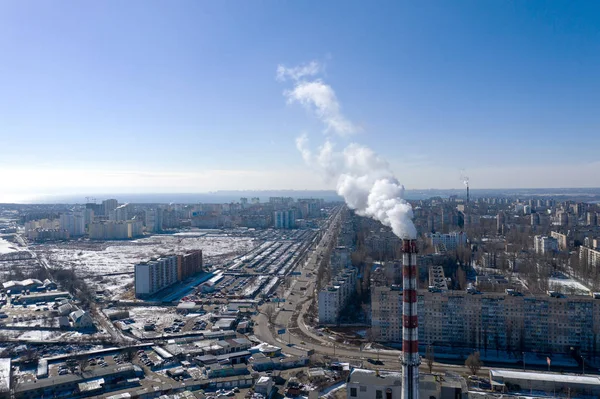 Air pollution, factory pipes, smoke from chimneys on sky background. Concept of industry, ecology, steam plant, heating season, global warming. Factory chimney smoking, smoke emissions from chimneys