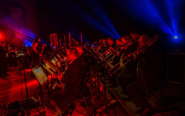 ODESSA, UKRAINE - March 23, 2019: Symphony orchestra concert on theater stage. Musicians of State Symphony Orchestra, instruments of symphony orchestra on stage. Score, sheet music during concert