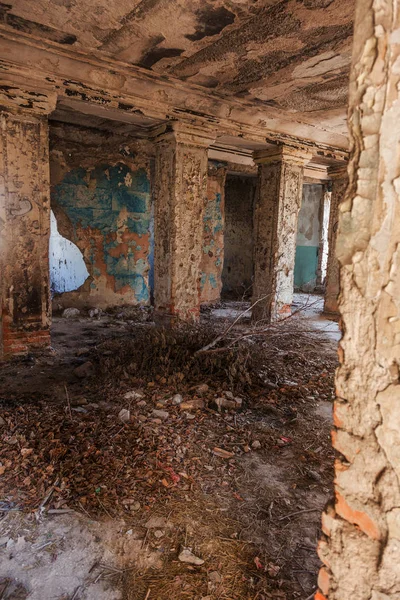 Mystical interior, ruins of an abandoned ruined building of house of culture, theater of USSR. Old destroyed walls, corridor with garbage and dirt. Destroyed molding, plaster ornaments, bas-relief