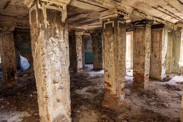 Mystical interior, ruins of an abandoned ruined building of house of culture, theater of USSR. Old destroyed walls, corridor with garbage and dirt. Destroyed molding, plaster ornaments, bas-relief