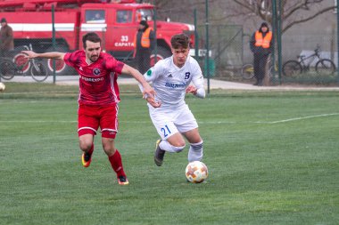 Odessa, Ukrayna-Mart 27, 2019: FC Balkanların First League maçı (Odessa)-FC Miner. Ukrayna 'nın ilk futbol ligi bölgesel ekipler oyunun gergin anları