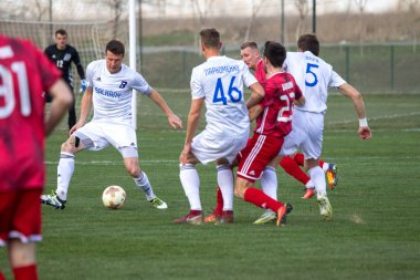 Odessa, Ukrayna-Mart 27, 2019: FC Balkanların First League maçı (Odessa)-FC Miner. Ukrayna 'nın ilk futbol ligi bölgesel ekipler oyunun gergin anları