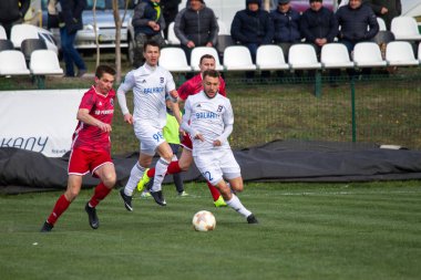 Odessa, Ukrayna-Mart 27, 2019: FC Balkanların First League maçı (Odessa)-FC Miner. Ukrayna 'nın ilk futbol ligi bölgesel ekipler oyunun gergin anları