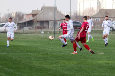 Odessa, Ukrayna-Mart 27, 2019: FC Balkanların First League maçı (Odessa)-FC Miner. Ukrayna 'nın ilk futbol ligi bölgesel ekipler oyunun gergin anları