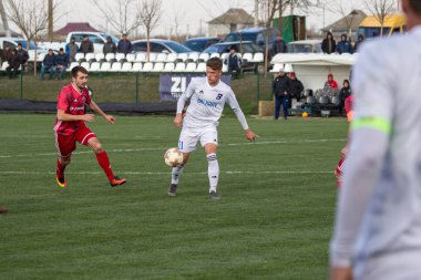 Odessa, Ukrayna-Mart 27, 2019: FC Balkanların First League maçı (Odessa)-FC Miner. Ukrayna 'nın ilk futbol ligi bölgesel ekipler oyunun gergin anları