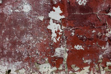 Alçı tuğla duvarın boş eski sanat dokusu. Yaprak dokusuyla boyanmış taş tuğla duvarın çatlaklarıyla kötü çizilmiş yüzey. Hasarlı alçıyla binanın ön cephesini ovaladım.