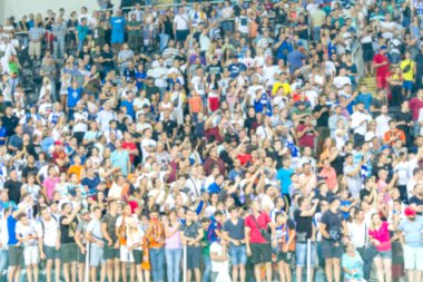 Odak dışında, keskin spor arka plan değil - stadyumda seyirci. Maç sırasında futbol stadyumu tribünlerinde taraftarlar tribünlerde taraftarlar la Tribune. Futbol taraftarları ile standları