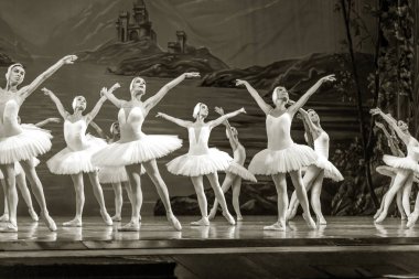 ODESSA, UKRAINE -JULY22, 2019: ballet. Classical ballet on stage of Odessa Opera Theater. Ballet dancers on stage dance classical works of Swan Lake. Form of artistic ball dance on stage of theater clipart