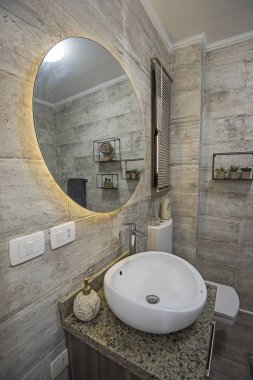 Interior design of a luxury show home bathroom with mirror and sink clipart