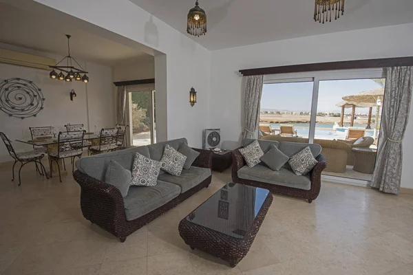 Living room lounge in luxury holiday villa show home showing interior design decor furnishing and open plan design