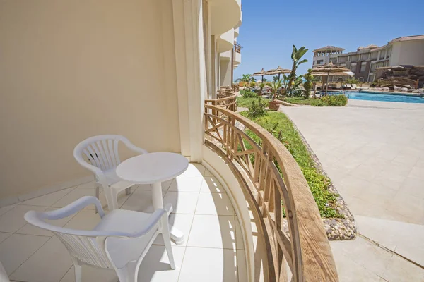 Terrace balcony with chairs at luxury tropical apartment resort