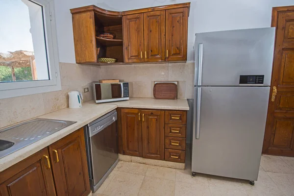 Kitchen in luxury villa show home showing interior design decor furnishing with fridge