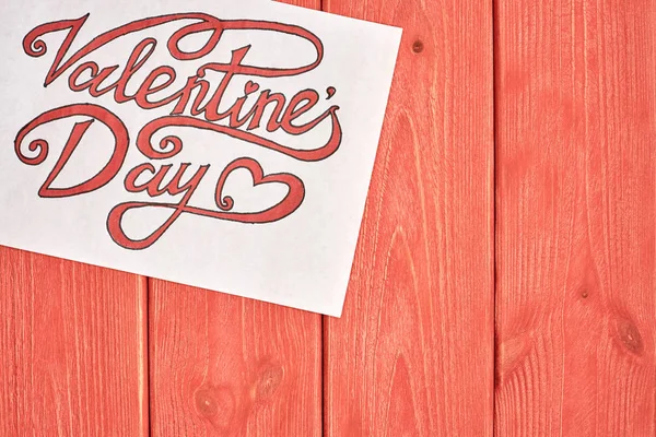 The red and black font is drawn in ink. Free space to insert design materials, suitable for a variety of solutions for Valentine\'s day. Close-up, top view.