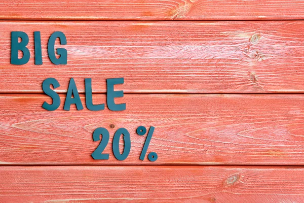 big sale lettering and discount offer at 20 percent, metal letters on textured wooden boards color season 2019, close up, top view, flat lay