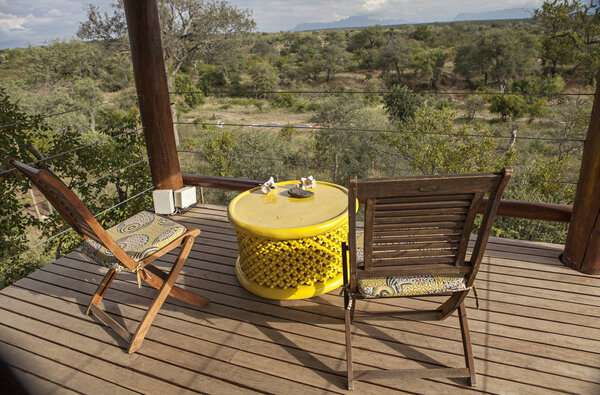 chairs and table in a lodge in kruger park