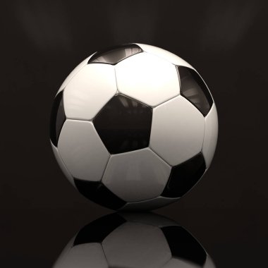 Koyu arka plan üzerinde gerçekçi futbol topu