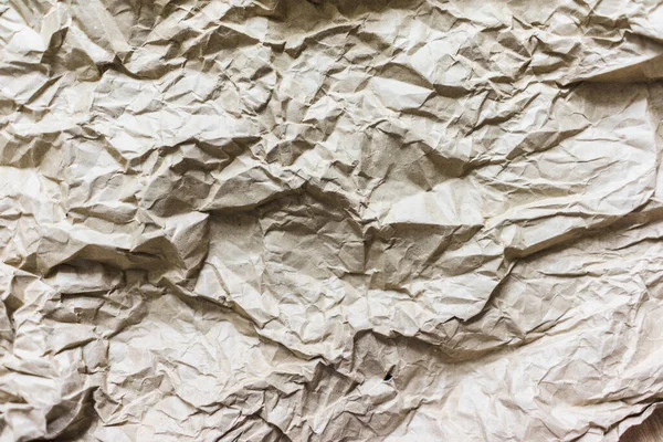 Papel de reciclaje de arrugas marrón fondo doblado textura de papel beige —  Fotos de Stock