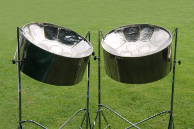 A Pair of Musical Metal Steel Drums on Stands. clipart