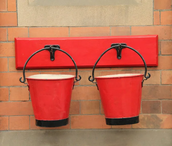 Two Red Vintage Fire Buckets Hanging Brick Wall — Stock Photo, Image