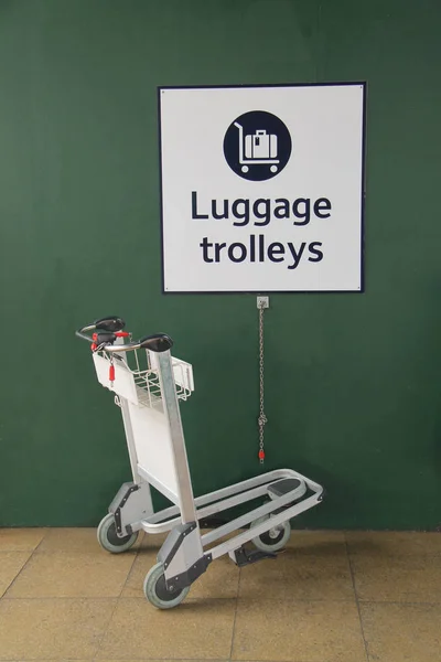 Storage Space and Sign for Passenger Luggage Trolleys.